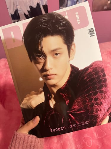 Reviewer holding their large Dazed & Confused magazine featuring TXT's Soobin on the cover.