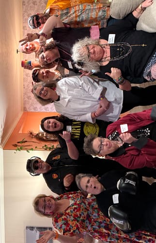 Reviewer's group of friends in fun costumes posing for a photo during the 1980s Murder Mystery Game.