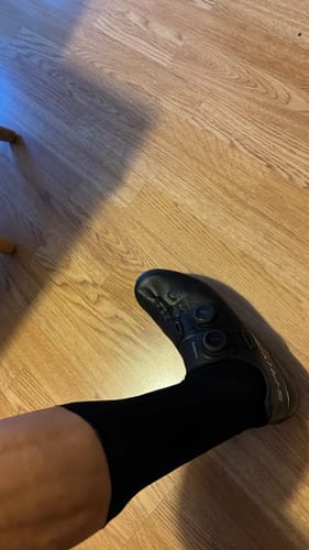 Customer wearing the black Aero Socks with a black cycling shoe, viewed from above.