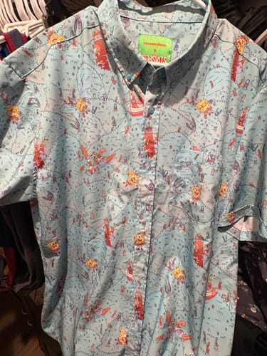 Customer's light blue SpongeBob "Meep Meep Meep" KUNUFLEX shirt on a hanger, showing the all-over character print.