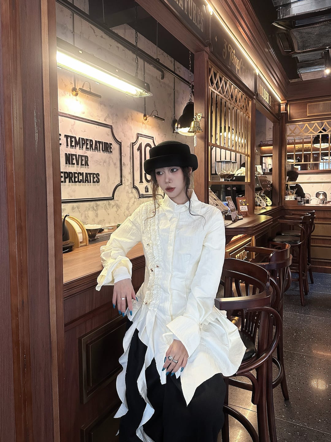 Customer photo review of DOINDULGE Asymmetric Ruched High-Neck Shirt with Sculptural Draped Panels