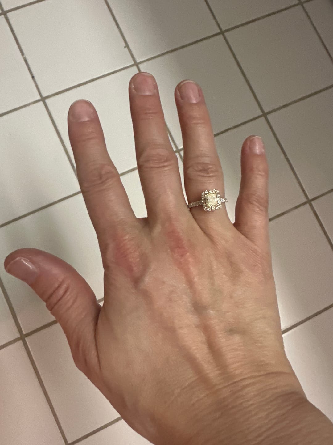Customer photo review of Classy 1.62CT Radiant and Round Cut Diamond Engagement Ring in 18KT Two Tone Gold