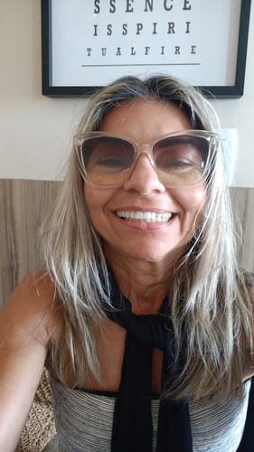 Reviewer smiling, showing a bright complexion after using the Neptune Tallow & Honey Balm.