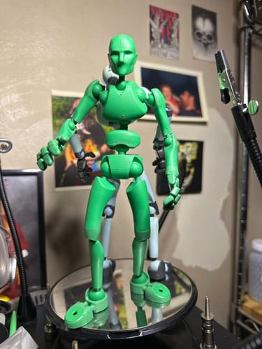 Customer's Green Flash Chroma-Key Edition figure in a dynamic pose on a mirrored turntable.