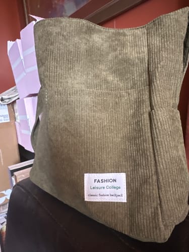 Customer's olive green Everyday Corduroy Shoulder Tote, looking full and roomy while sitting upright on a surface.