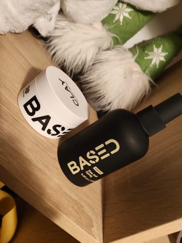 Customer's Texture & Hold Duo, showing the white clay pot and black sea salt spray bottle on a wooden surface.