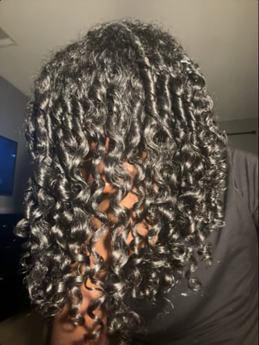 Reviewer's long 3B curls looking shiny and moisturized after using the Leave-In Conditioner.