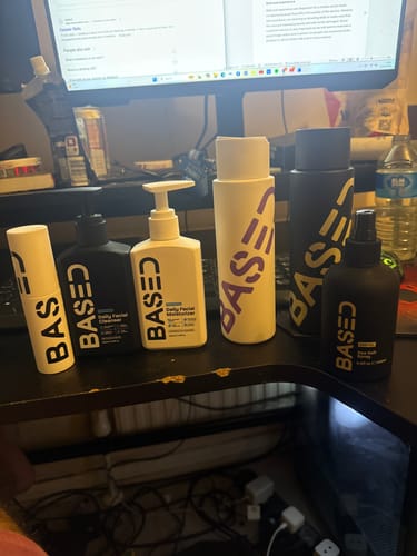 A customer's collection of the Daily Skincare Duo and other products from the brand on a desk.