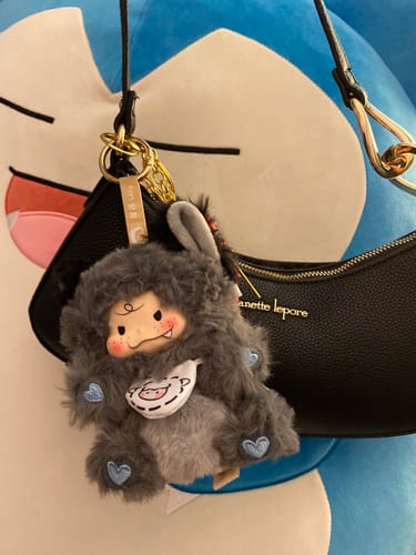 Customer's cute Matchy Lacy Series 'big bad wolf' plush pendant used as a charm on a black handbag.