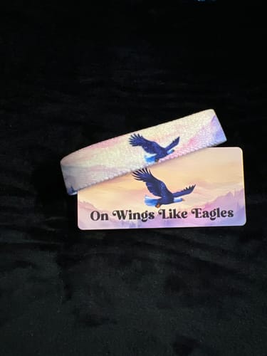 Reviewer's On Wings Like Eagles bracelet and matching card featuring the eagle design.