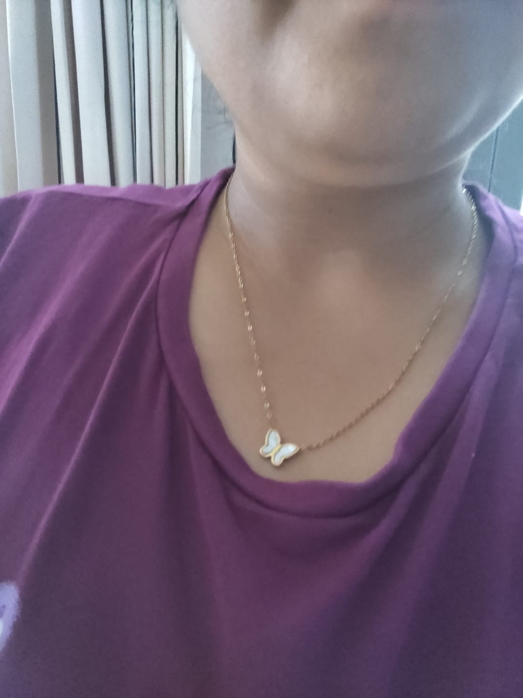 Customer photo review of Little Butterfly Necklace