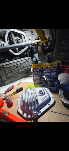 Customer's raw SPE Motorsport Front Differential Cover on a workbench before installation on their truck.