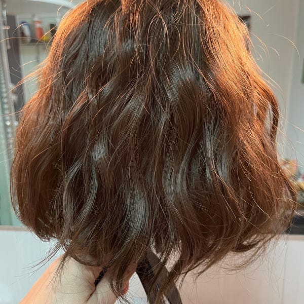 Customer photo review of Women Dark Brown Curly Short Bob Wig With Bangs Water Wave Natural Looking