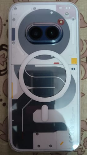 Reviewer's image for the StickyPod shows the back of a phone with a white ring on a clear case.