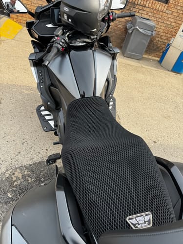 Customer's black Wind Rider Seat Cover with a mesh design fitted onto a touring motorcycle.