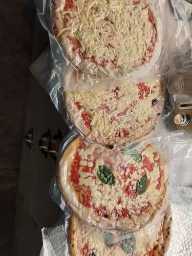 Customer photo review of Topped Three Cheese Pizza