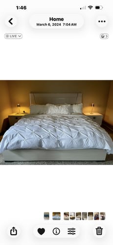 Reviewer's clean white bedding on a bed after using the laundry detergent sheets.