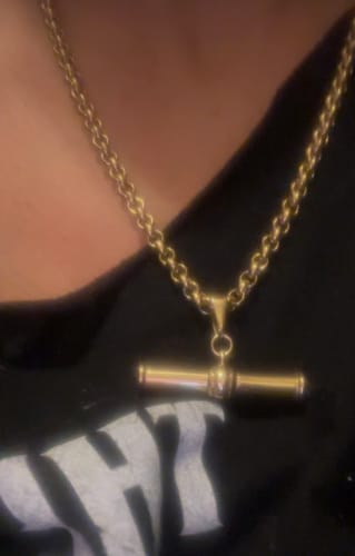 Close-up of a customer wearing the gold XL T-Bar Necklace, highlighting its thick chain.