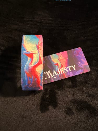Customer's Majesty Dragon Bracelet is shown unstretched with its card, revealing a colorful dragon design.