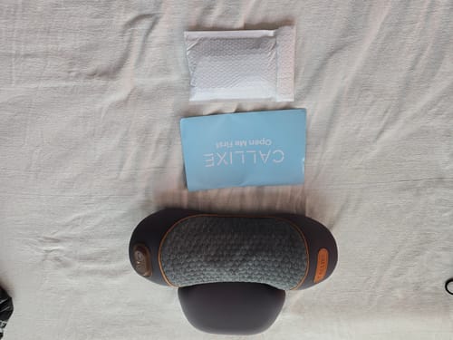 Customer's Callixe Thera Pillow unboxed with its packaging on a light-colored surface.
