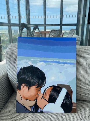 Customer's finished painting from the Paint by Numbers Custom Kit, showing a couple kissing.