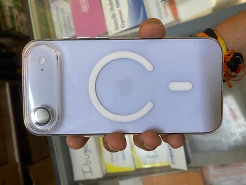 Customer holding a phone with the Anti Yellow Transparent Clear Case, showing the MagSafe feature on the back.