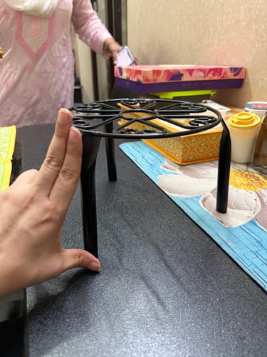 Customer photo review of UnitedCrafts Trivia Metal Pot Stand High Quality & Unique Design