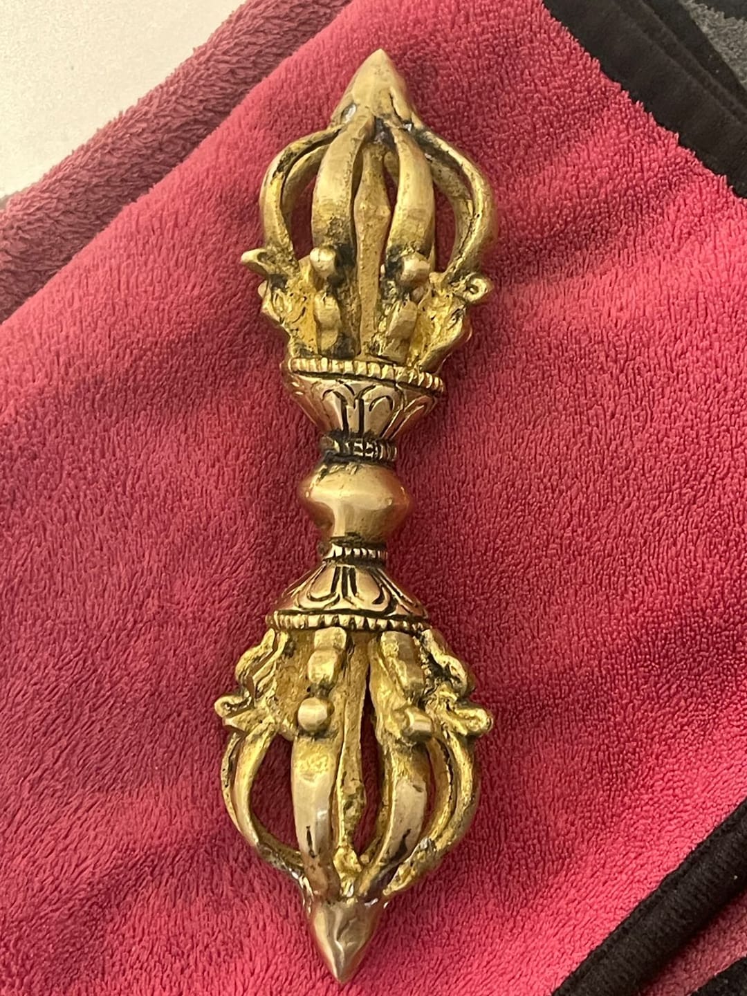 Customer photo review of Brass Vajra Dorje Ritual Tool Vastu Remedy for Protection, Tibetan Meditation and Home Temple Energy 15.7 x 4 cm | 340 gm