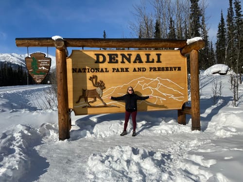 Customer wearing the black Peyton Turtleneck as a warm layer in snowy Denali National Park.