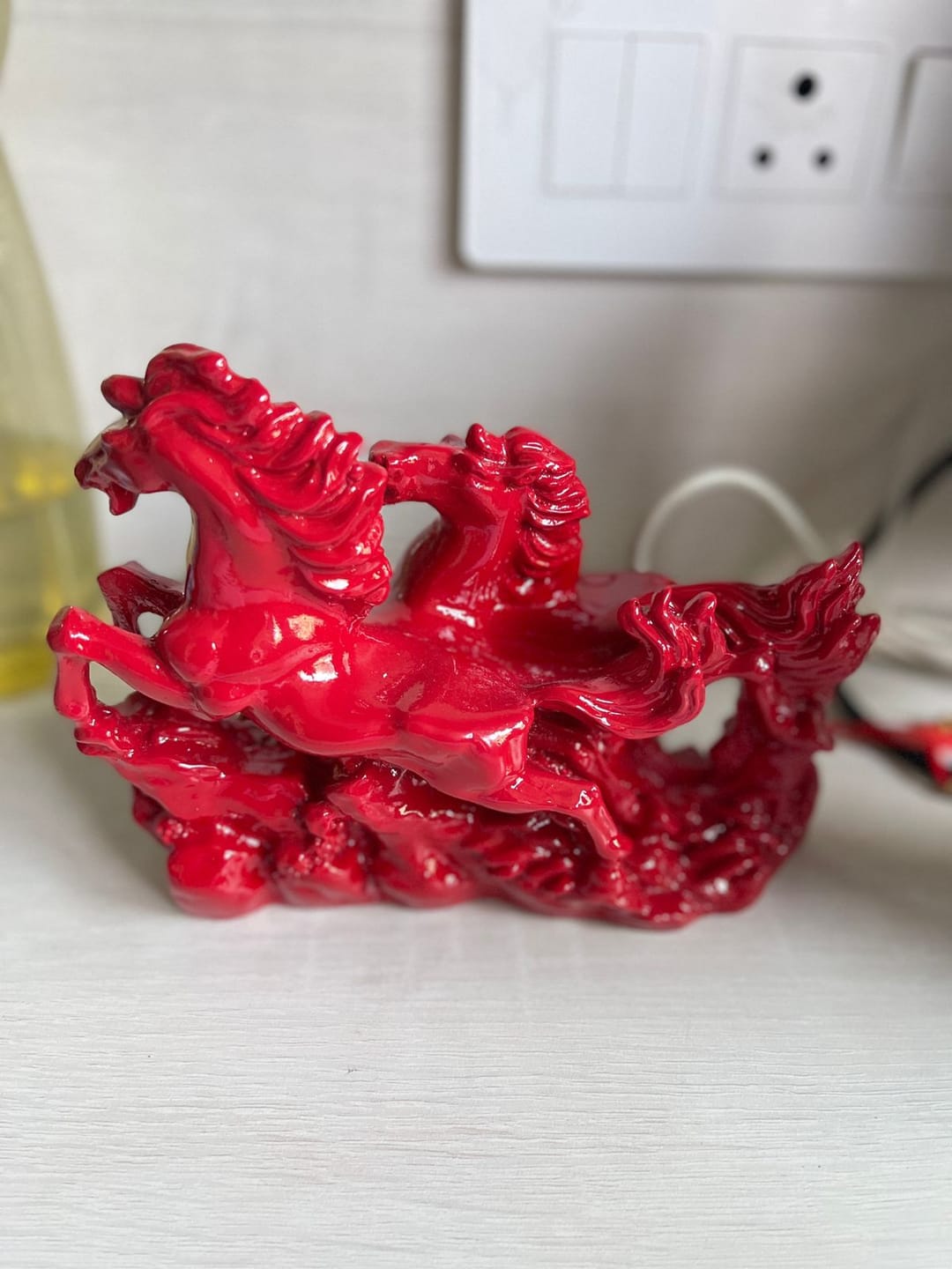 Customer photo review of Dynamic Red Running Horses Resin Sculpture Vastu Remedy for Speed, Success and Career Momentum for Office Desk, Business Spaces and Home Decor | 21 x 16 cm | 550 gm