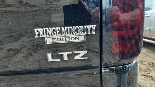 Customer photo review of FRINGE MINORITY EDITION Car Badge Metal Emblem