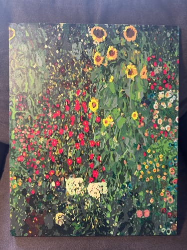 Customer's completed Sunflower Park paint-by-numbers project, showing a colorful garden scene with bright sunflowers.