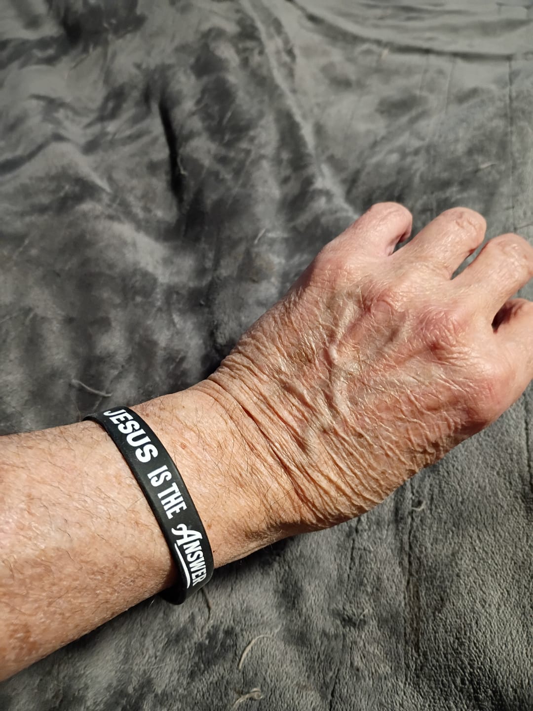Customer photo review of Jesus Is The Answer Wristband