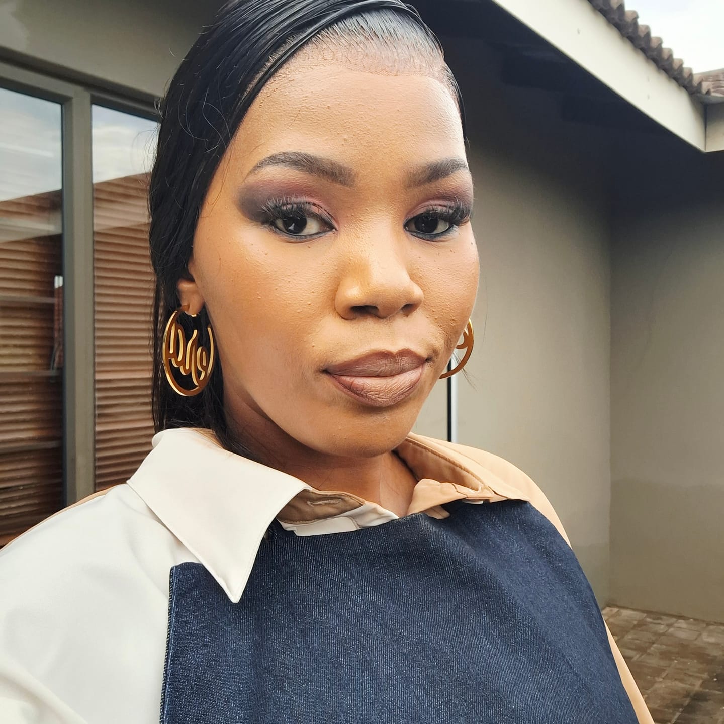 Customer photo review of Gold Luxe Logo Hoops