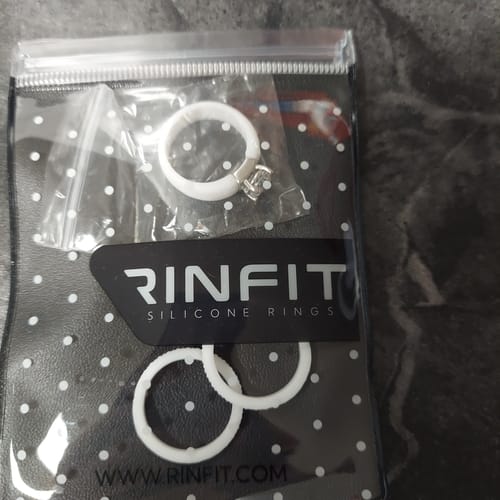 Customer's white Silicone Ring Stackable Set, shown unstacked and in its original packaging.