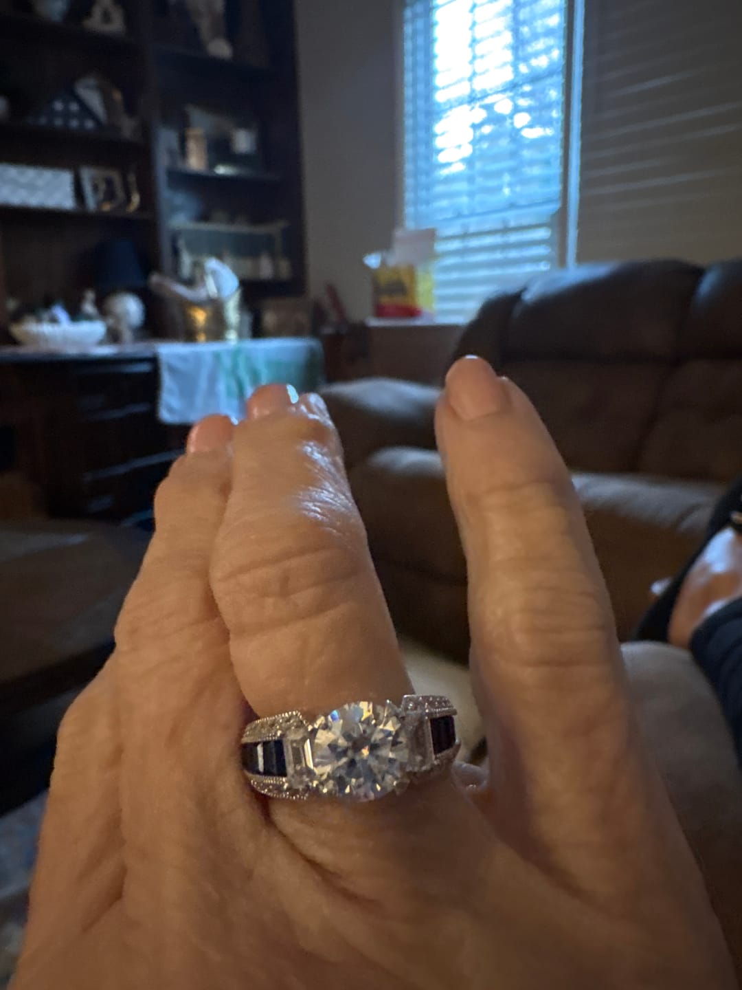 Customer photo review of Round Moissanite And Emerald-Cut Sapphire Channel Set Milgrain Engagement Ring