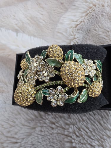 Customer's close-up of the sparkly Lemon Blossoms Crystal Bracelet, showing crystal lemons and green enamel leaves.