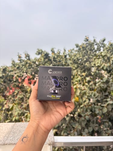 Customer's hand holding the black box for the 360° MagPro Magnetic Phone Holder.