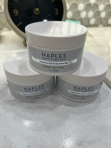 Customer shows their stock of three jars of Fragrance Free Body Butter on a counter.