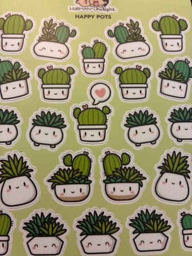 A customer's 'Happy Pots' sticker sheet, featuring many cute designs of smiling cacti and succulents in small pots.