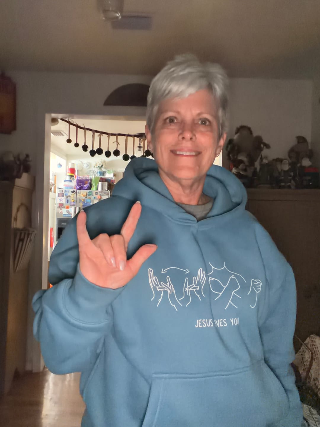 Customer photo review of JESUS LOVES YOU ASL - HEAVYWEIGHT OVERSIZED HOODIE