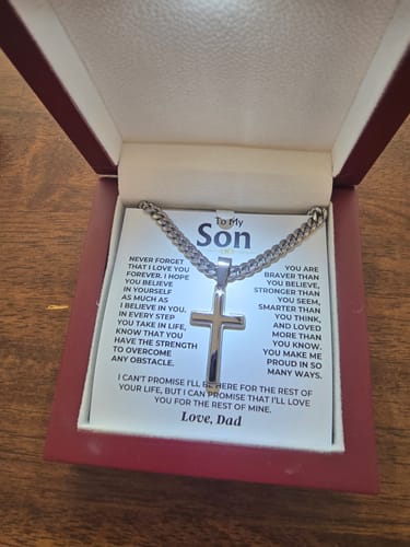 Customer's review of the Artisan Cross gift set, showing the necklace in its lighted mahogany-style box with the message card.