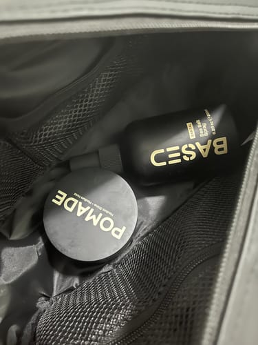 Customer's Beachy Flow Duoproduct pomade and spray inside a black travel bag.