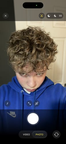 Reviewer shows their styled, curly hair after using the Hair Clay.