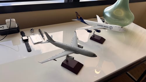 Customer's grey GEMINI200 French Air Force A330-200 model airplane on a white desk.