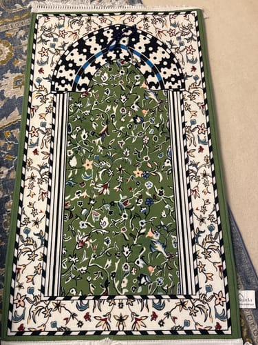 Reviewer's Padded Prayer Mat in green, laid out to show its intricate floral pattern.