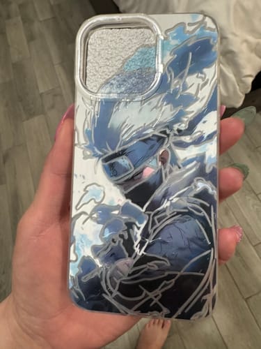 Reviewer holding the detailed KAKASHI HATAKE phone case, showing the artwork where Kakashi's eye is not red.