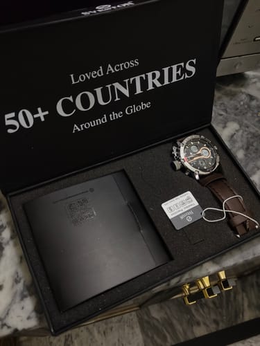 Reviewer's Zoddok 1.0 watch with a brown leather strap, shown inside its black presentation box.