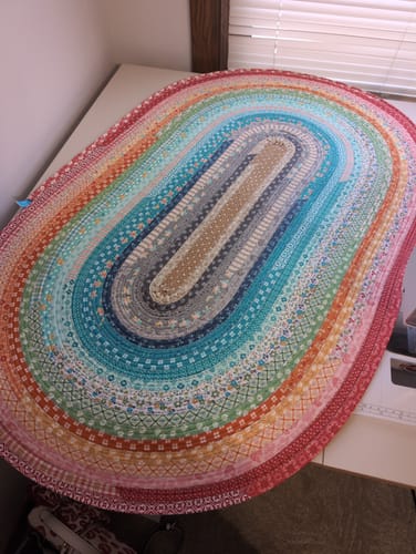 Customer's colorful, finished jelly-roll rug made with the Uniquely Mateo Ambassador Box.