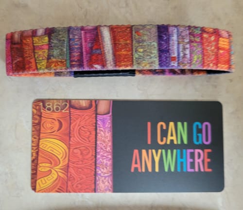 Customer's I Can Go Anywhere Bracelet with a colorful book spine design, shown with its matching product card.